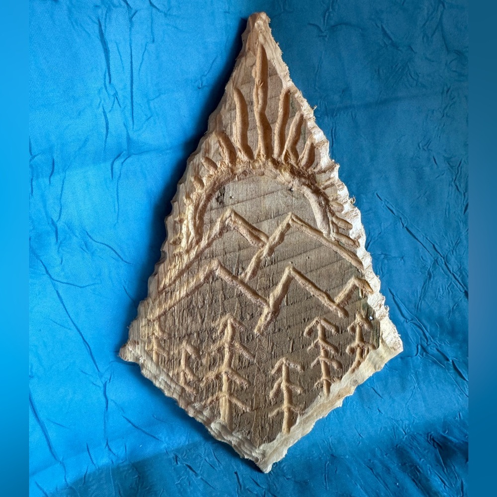 Hand carved mountain scene